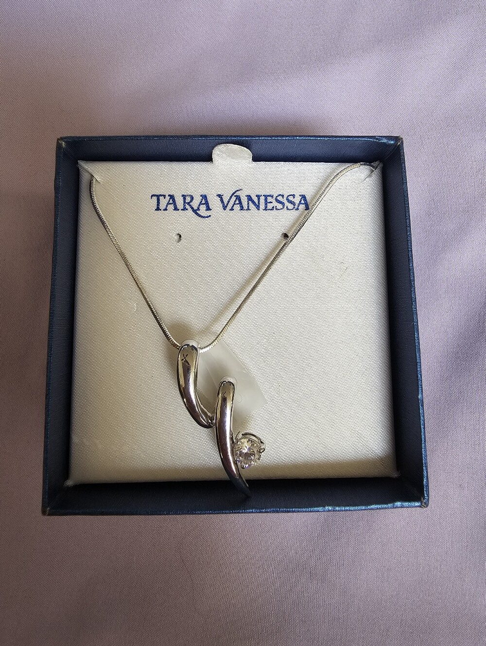 Silver Curved Pendant Necklace with Clear Stone Accent